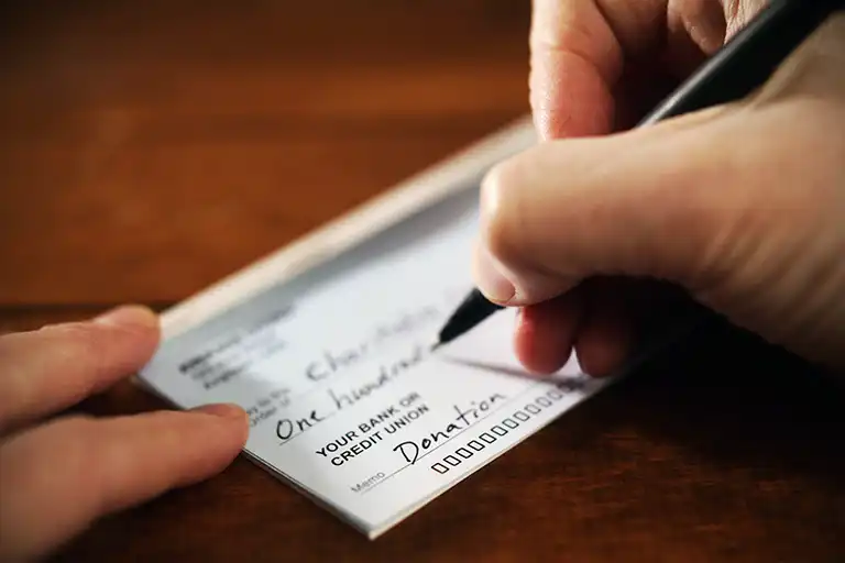 Signing a donation form